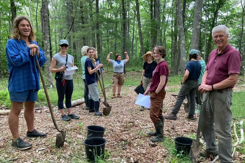 Volunteers from TACF and the Maine Coast Heritage Trust plant a grove of chestnut trees at the Cousins River Fields and Marsh Preserve in Yarmouth.