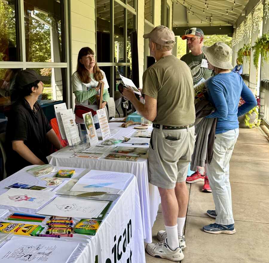 TACF table with American chestnut information. Children's activities on front table.