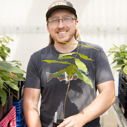 Noah Vincent in the greenhouse