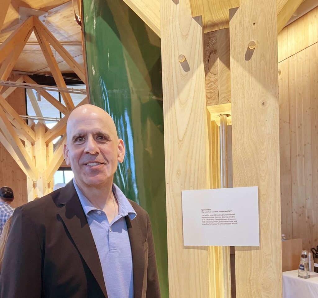 Michael Goergen poses next to a column made of American chestnut at the National Museum of Forest Service History.